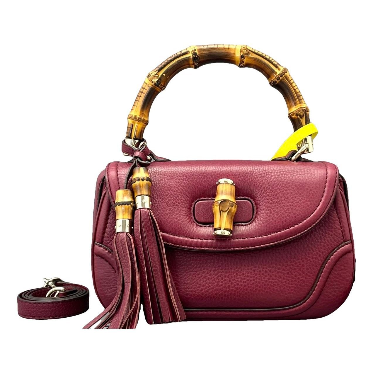 Convertible Pompon Bamboo Top Handle leather handbag