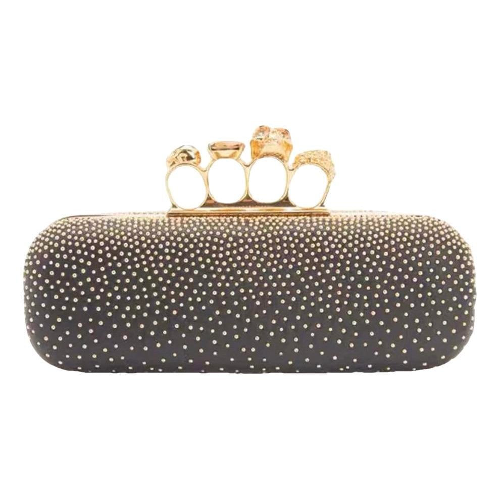 Knuckle leather clutch bag
