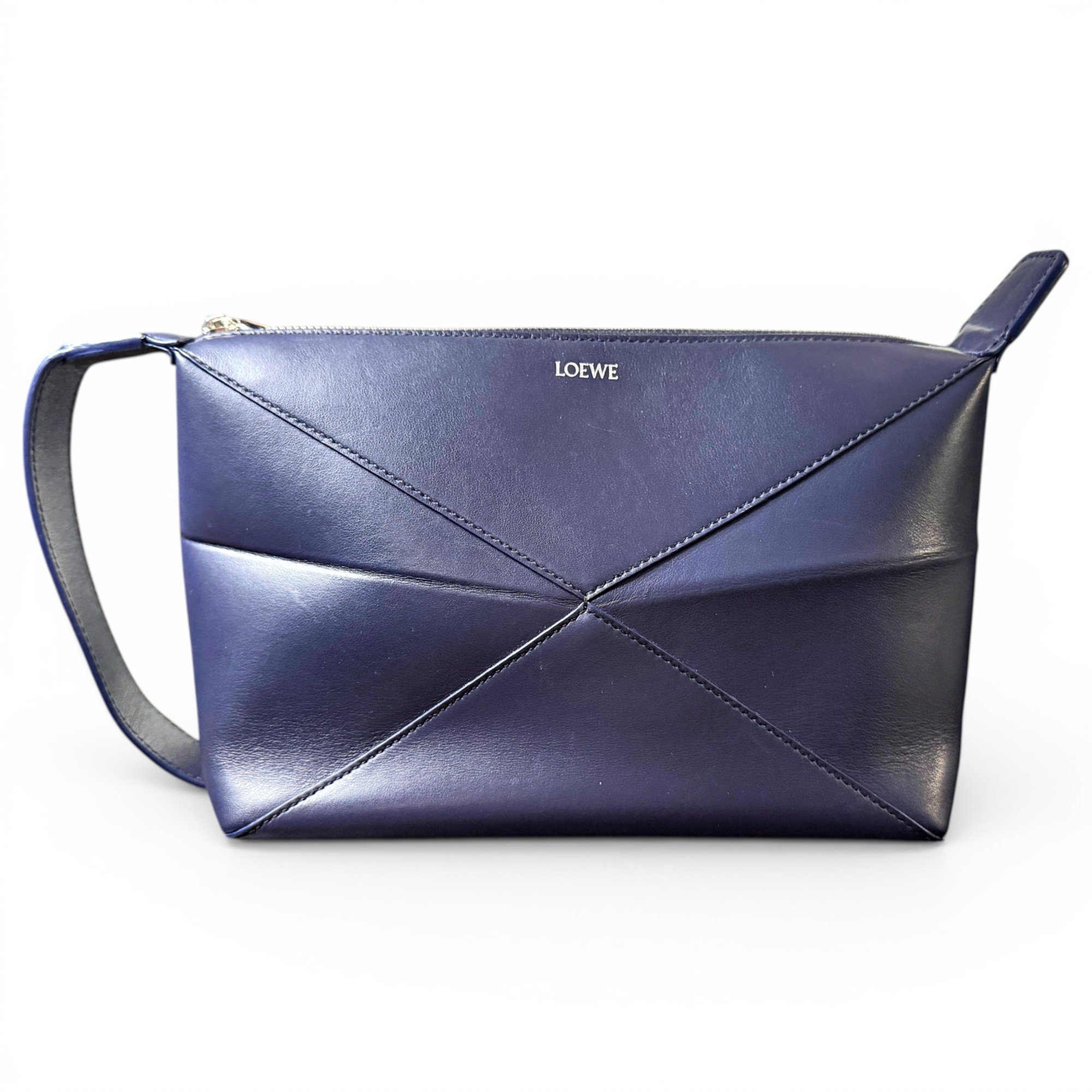 Puzzle leather clutch bag