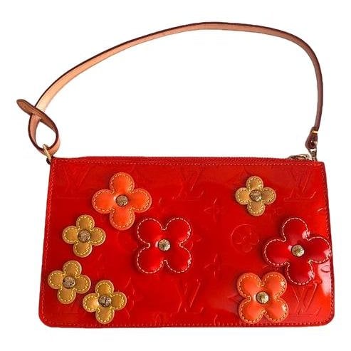 Pochette Accessoire patent leather handbag