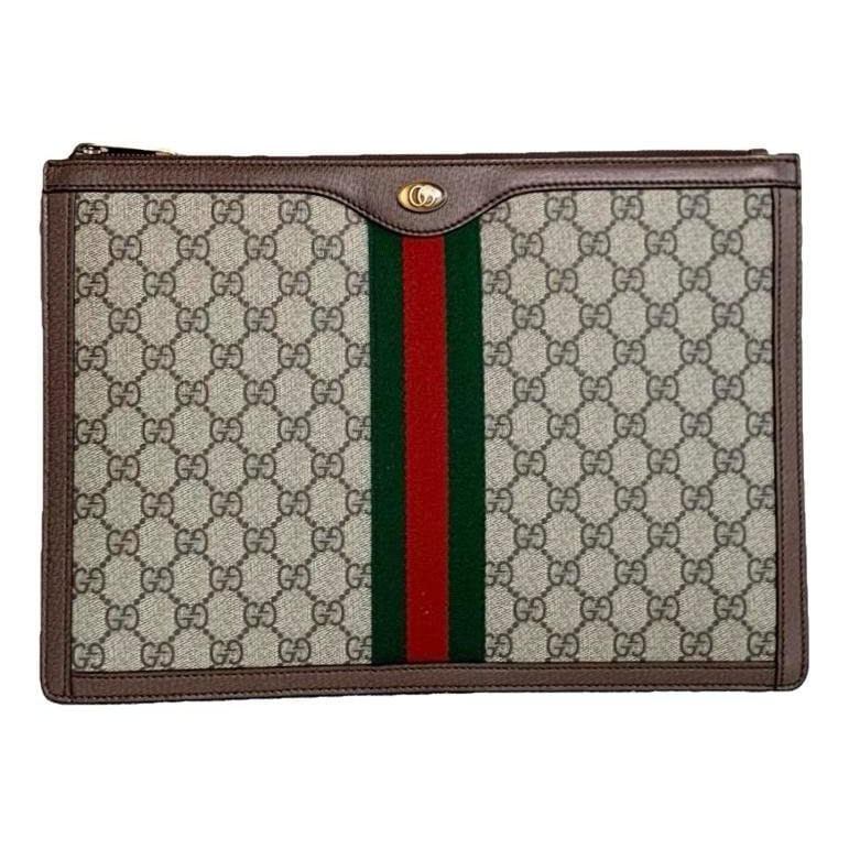 Ophidia vinyl clutch bag