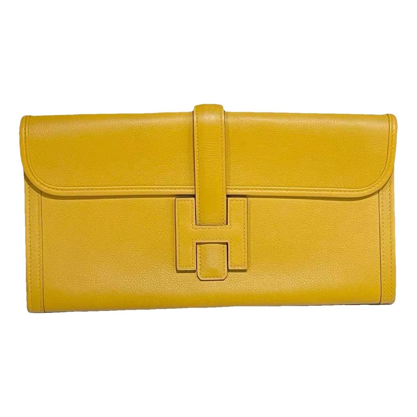 Jige leather clutch bag