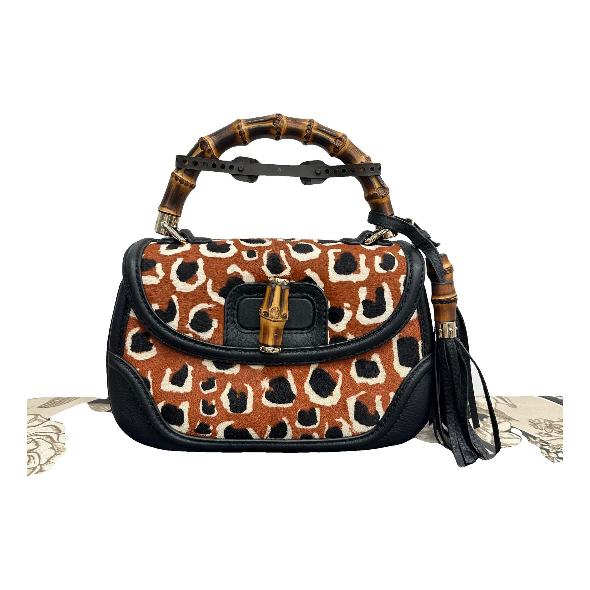 Convertible Pompon Bamboo Top Handle leather handbag