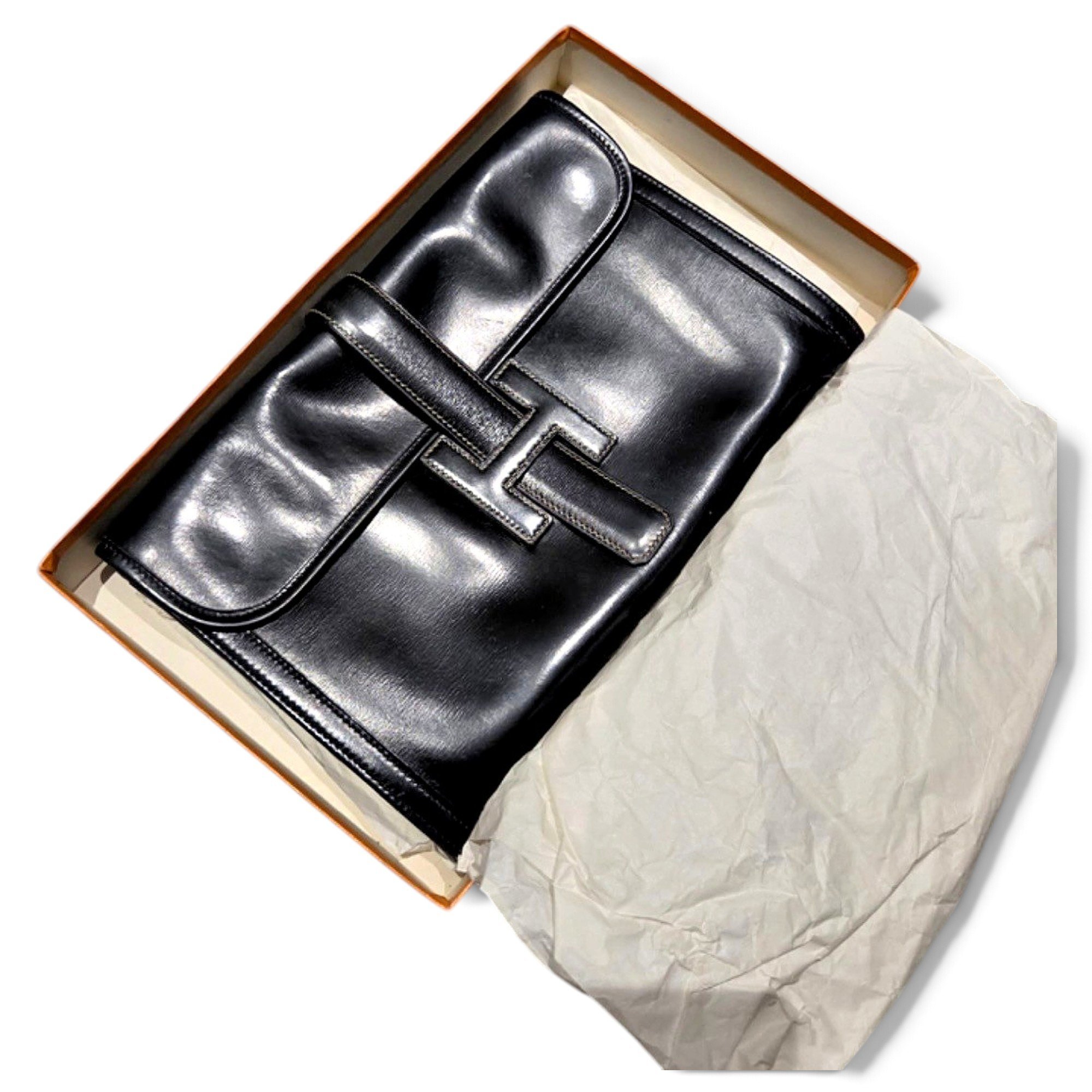 Jige leather clutch bag