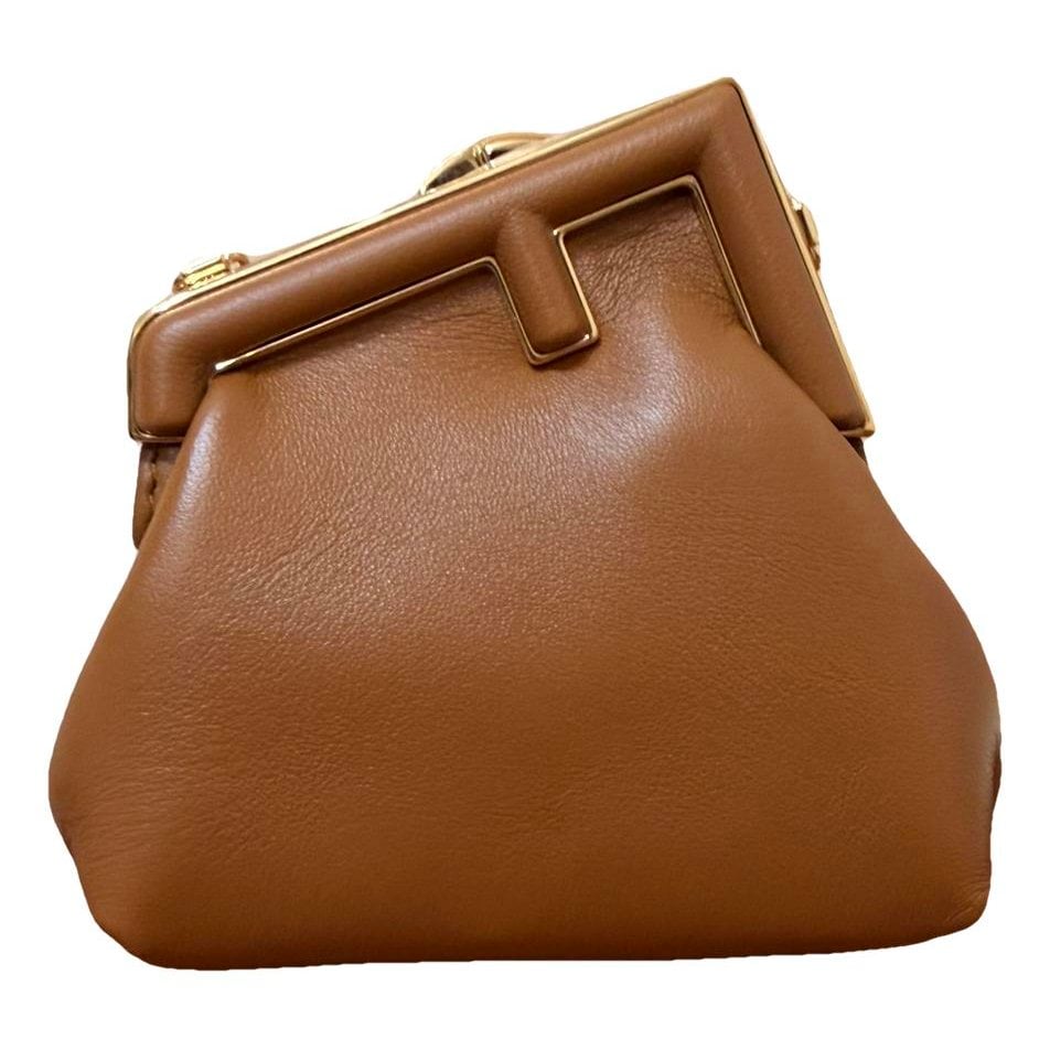 First leather handbag