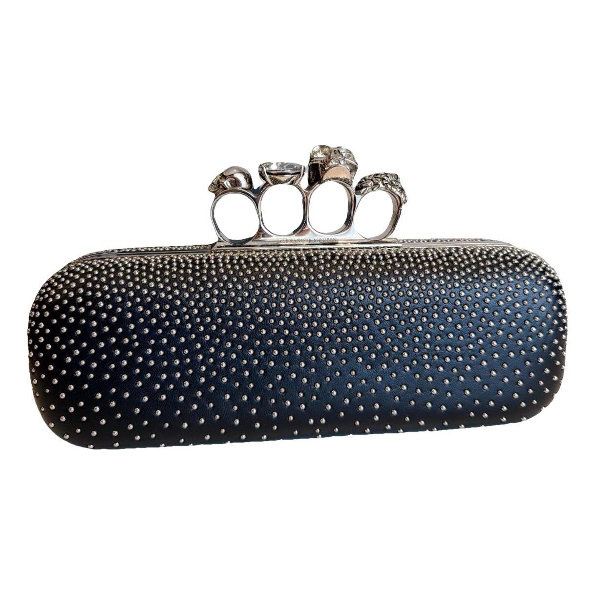 Knuckle leather clutch bag