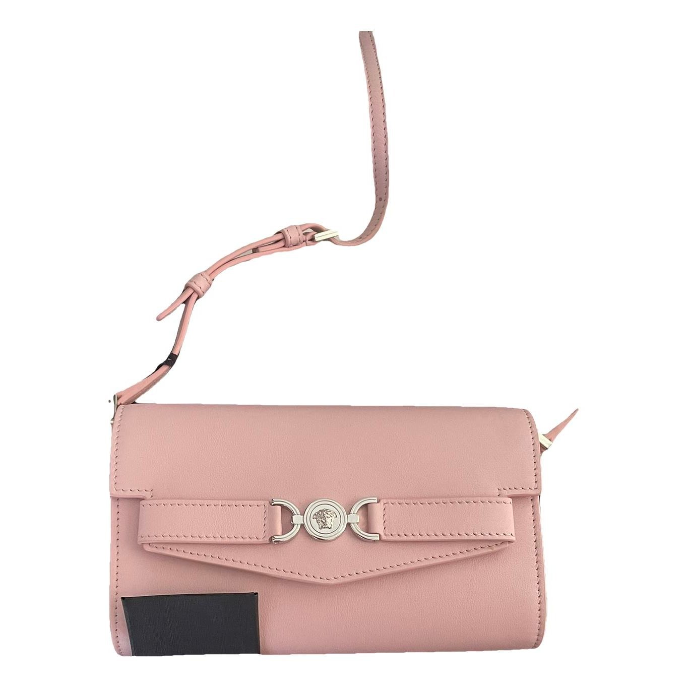 La Medusa leather clutch bag