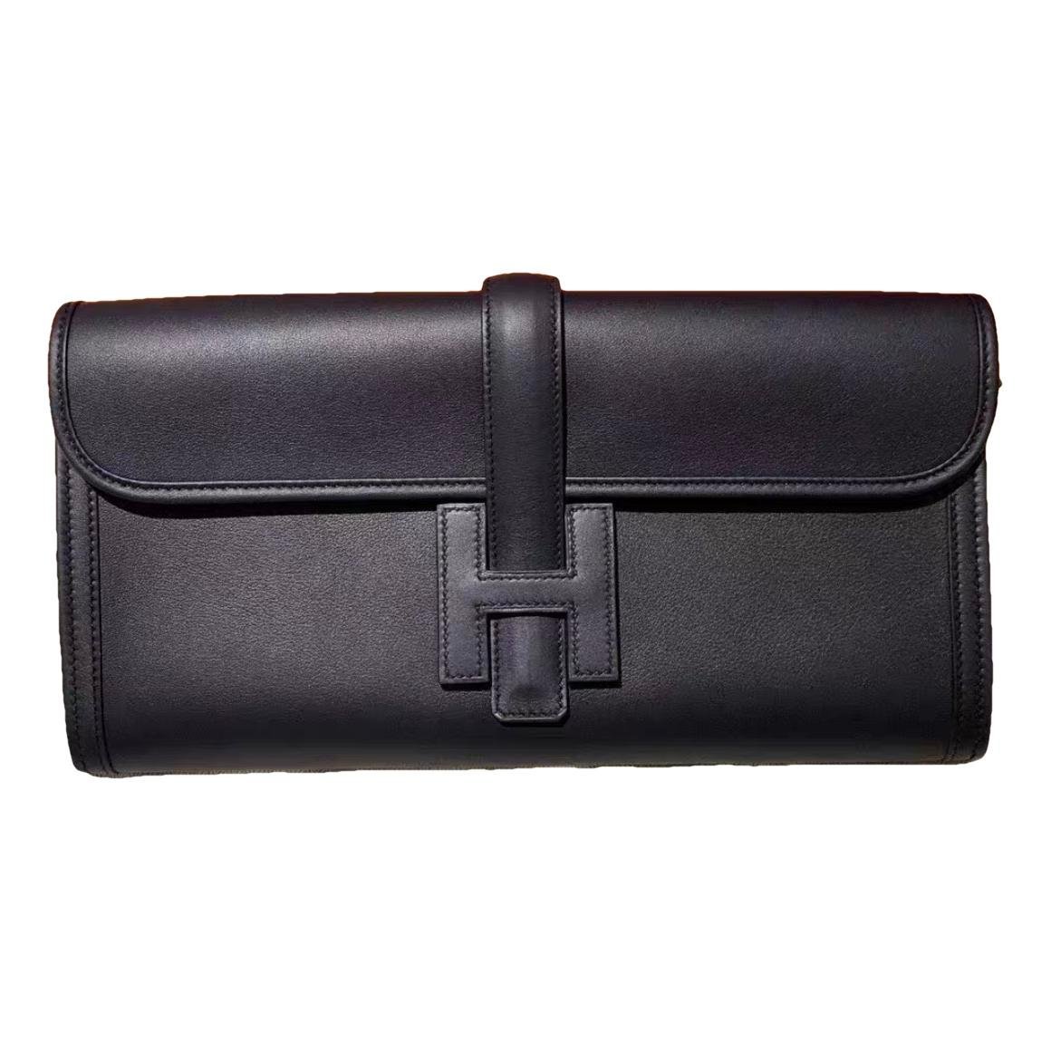 Jige leather clutch bag