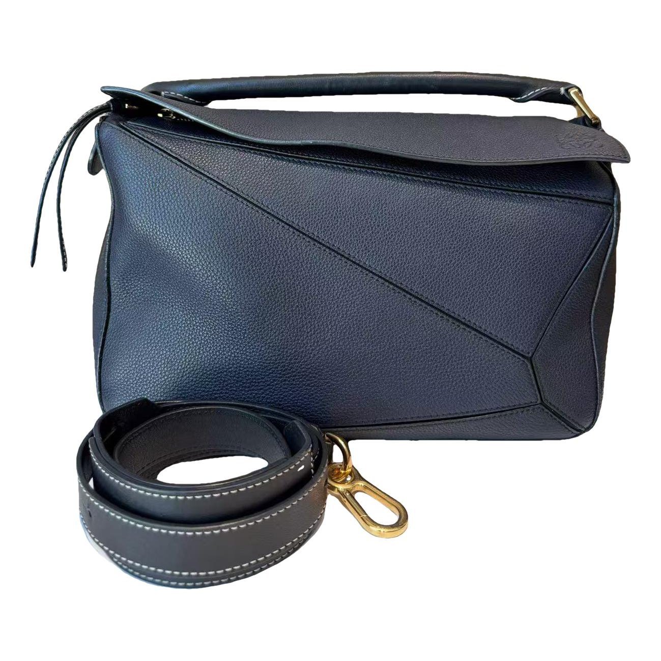 Puzzle leather handbag