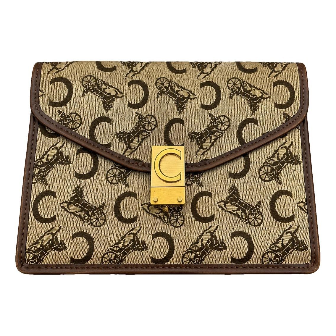 Triomphe Vintage cloth clutch bag