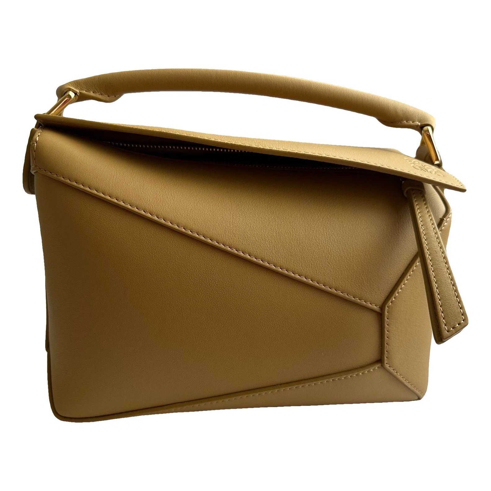 Puzzle leather clutch bag