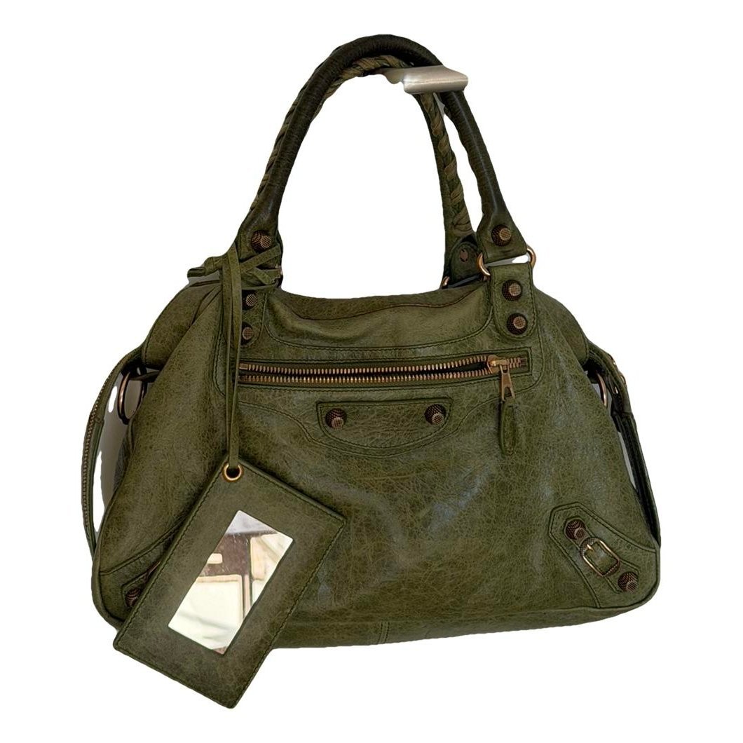 First leather handbag