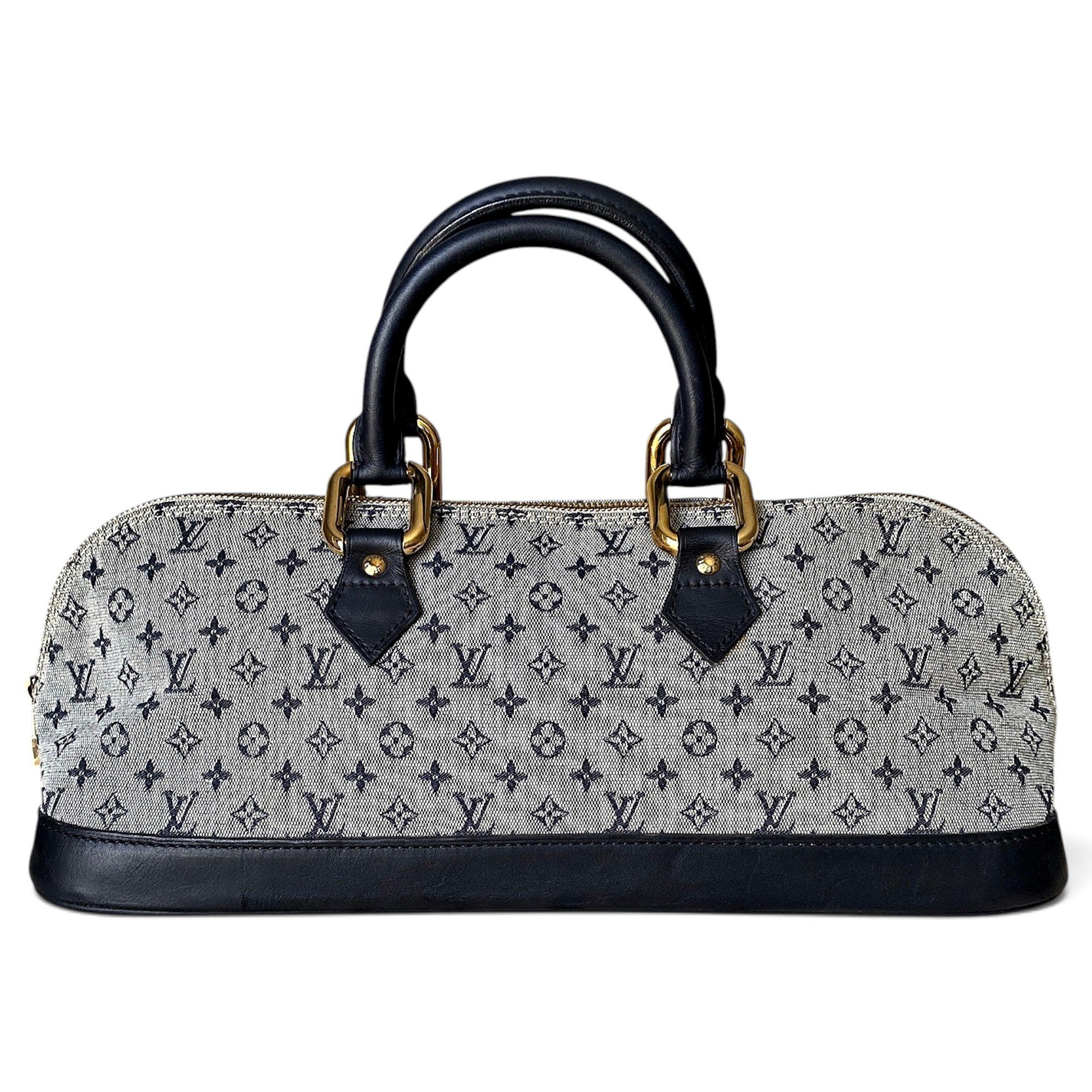 Louis Vuitton Alma Long cloth handbag