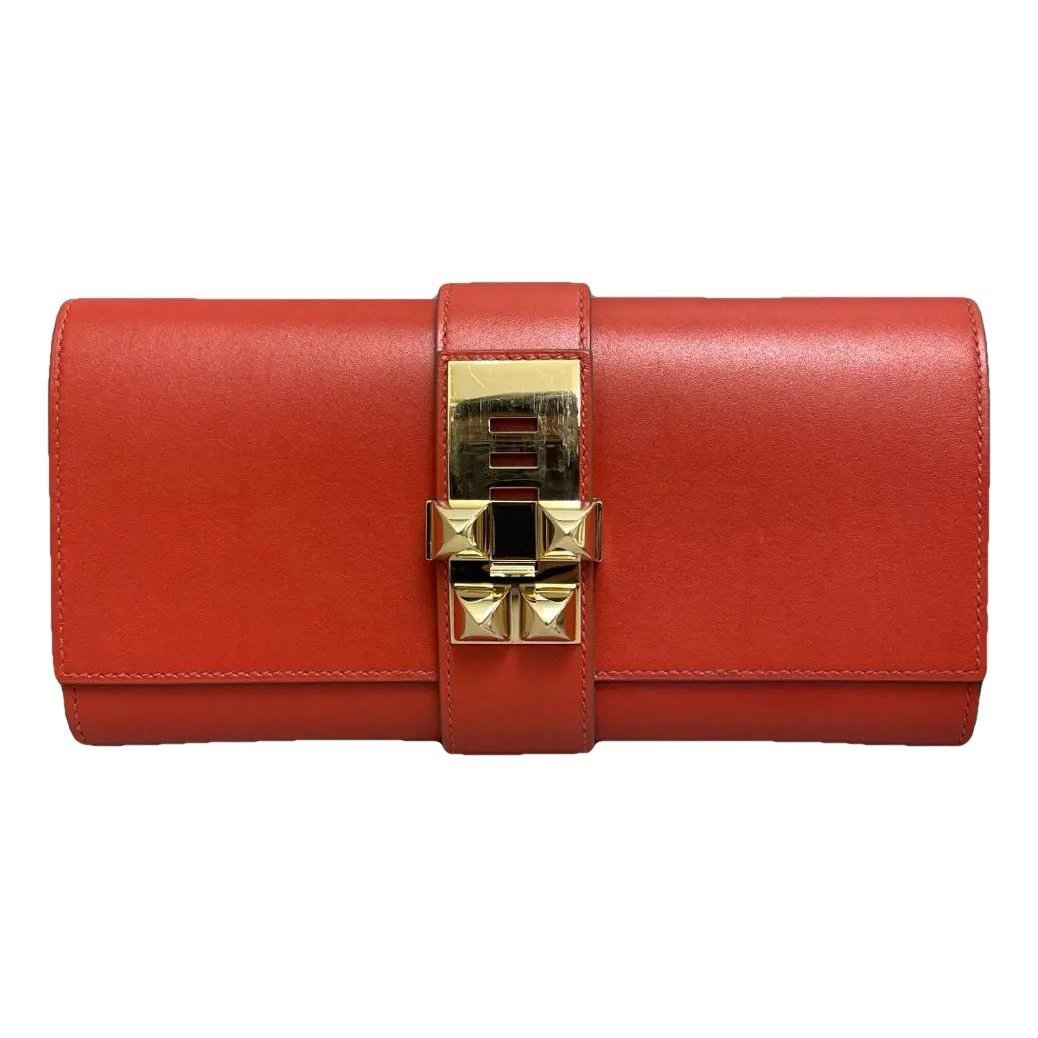 Médor leather clutch bag