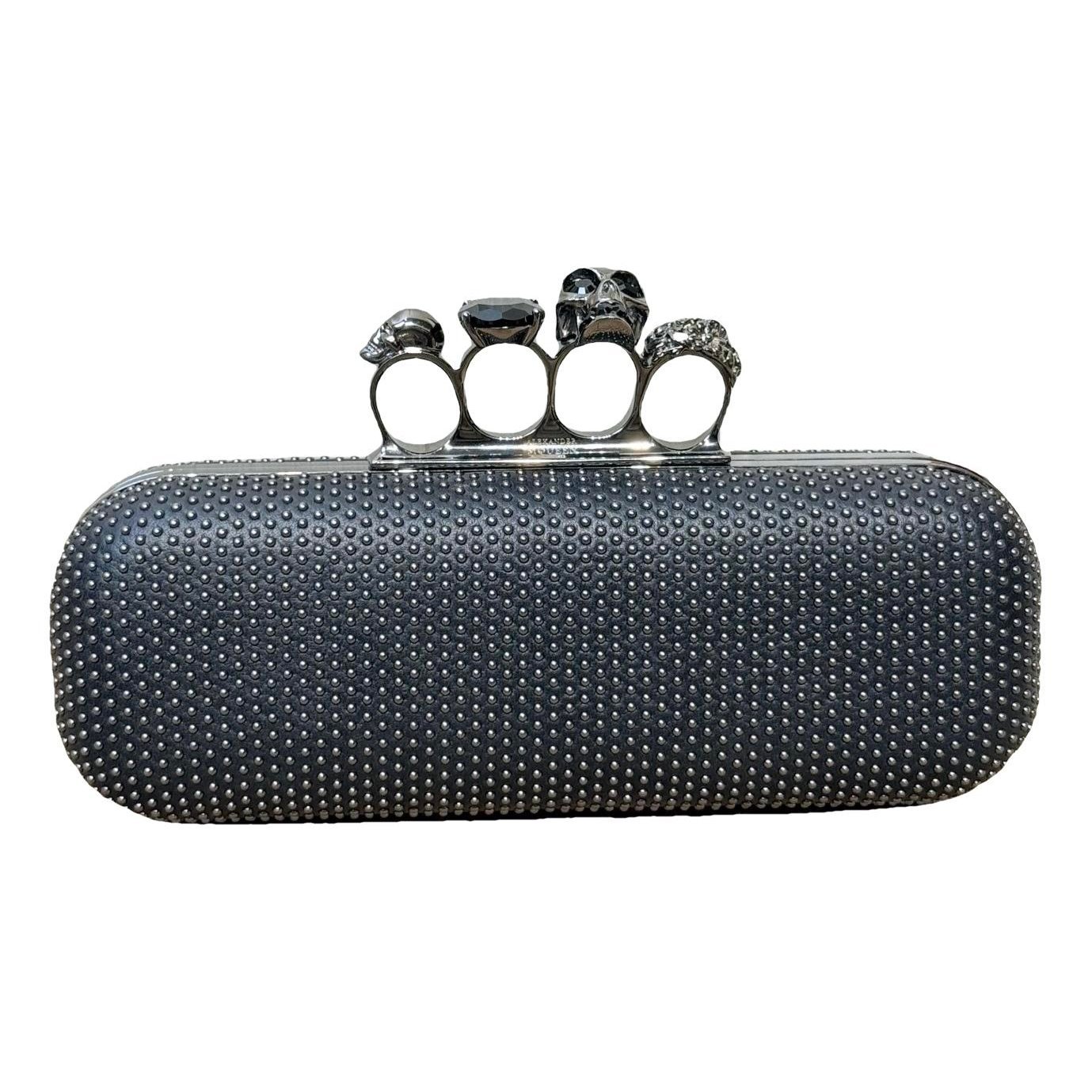 Knuckle leather clutch bag