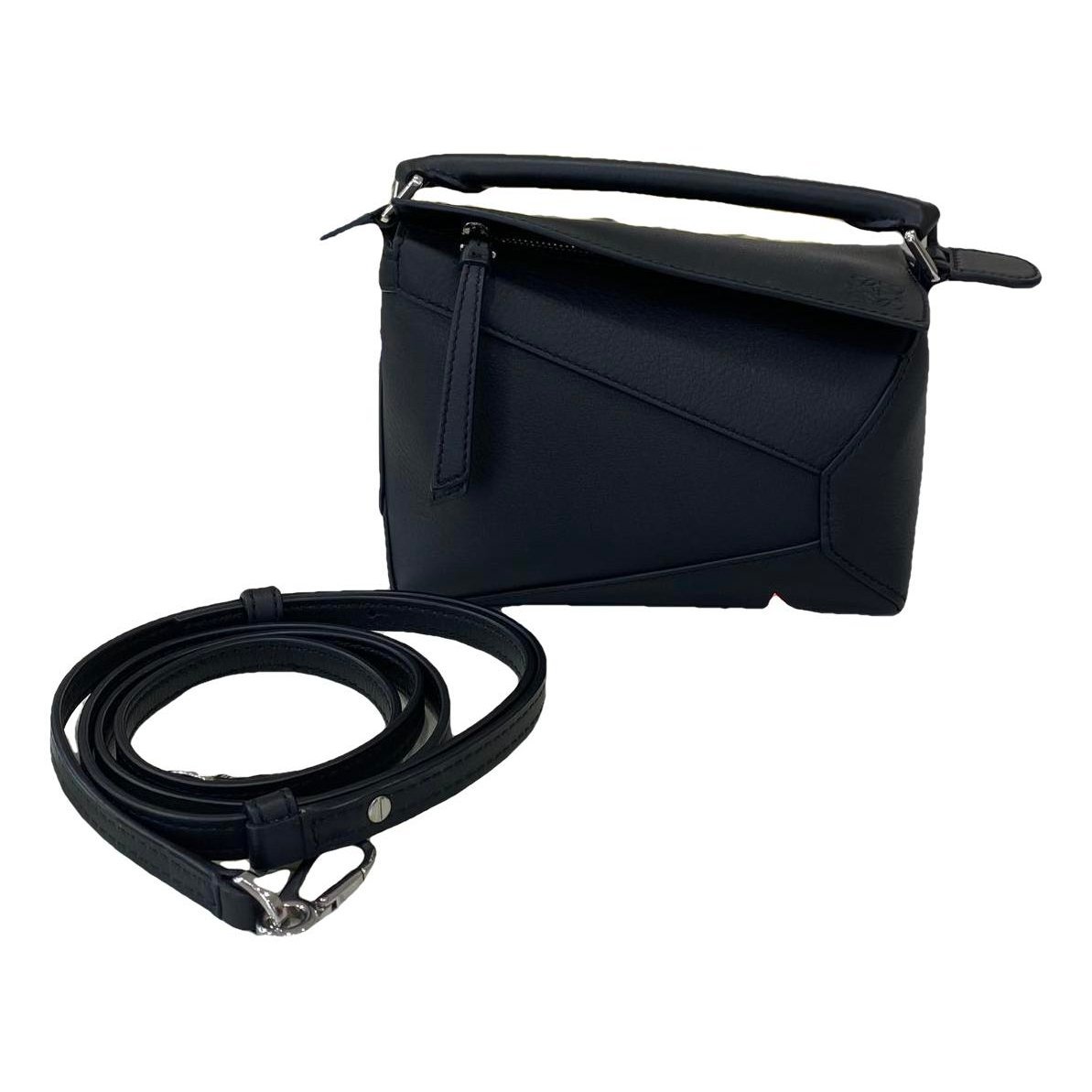 Puzzle leather handbag
