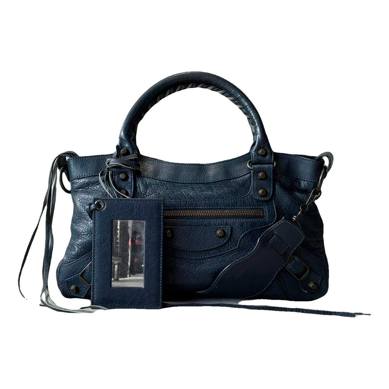 First leather handbag