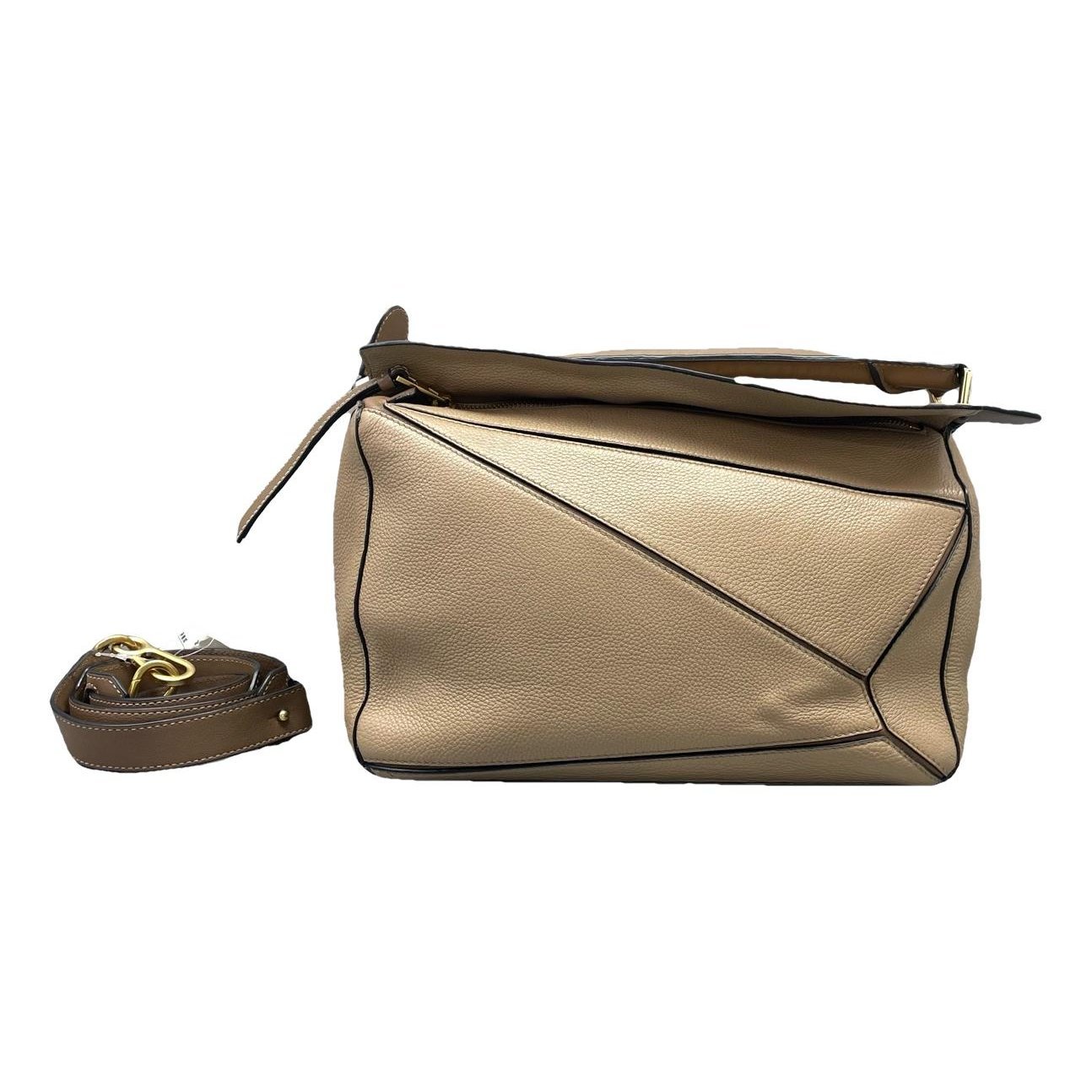 Puzzle leather handbag