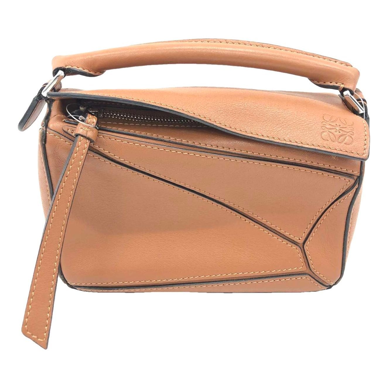 Puzzle leather handbag