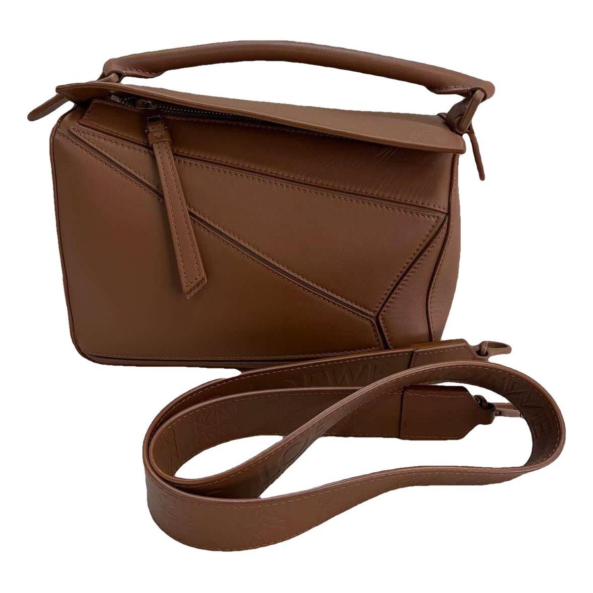 Puzzle leather handbag