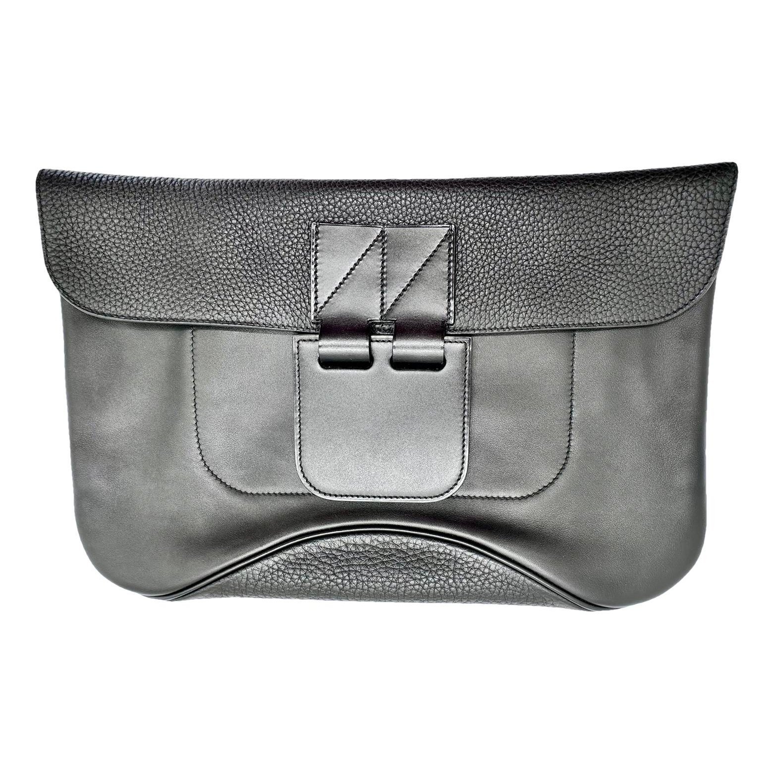 Virevolte leather clutch bag