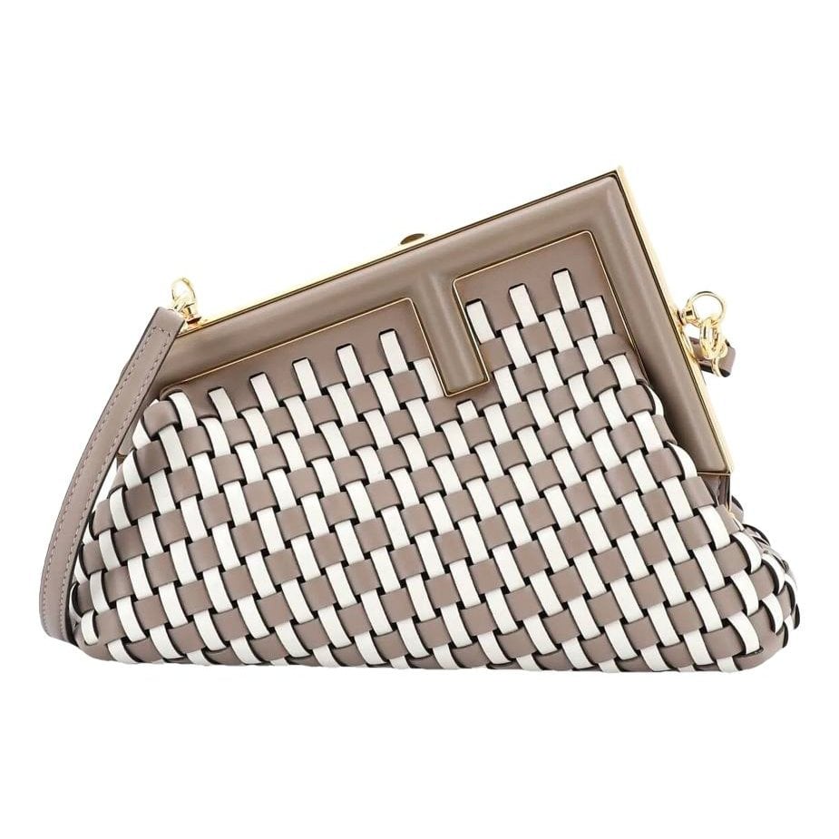 First leather handbag
