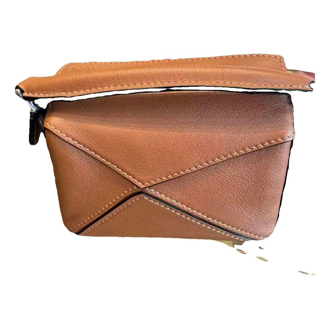 Puzzle leather handbag