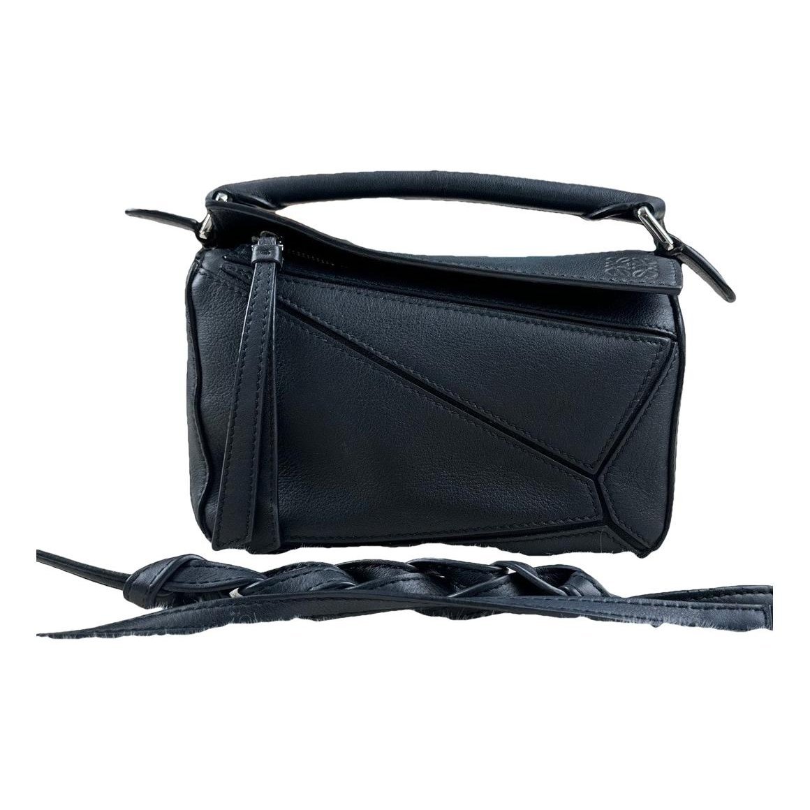 Puzzle leather handbag