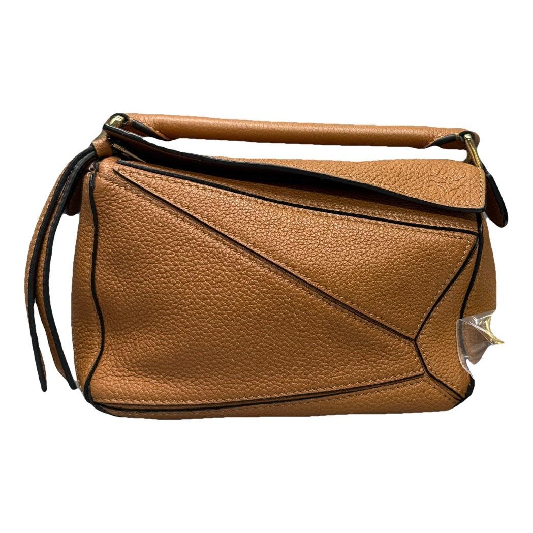 Puzzle leather handbag