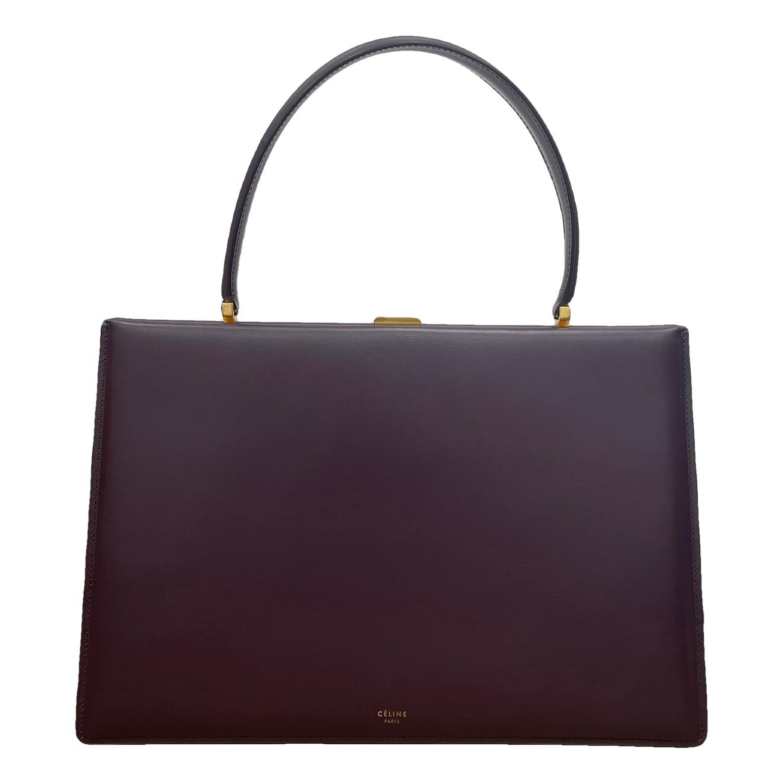 Clasp leather handbag