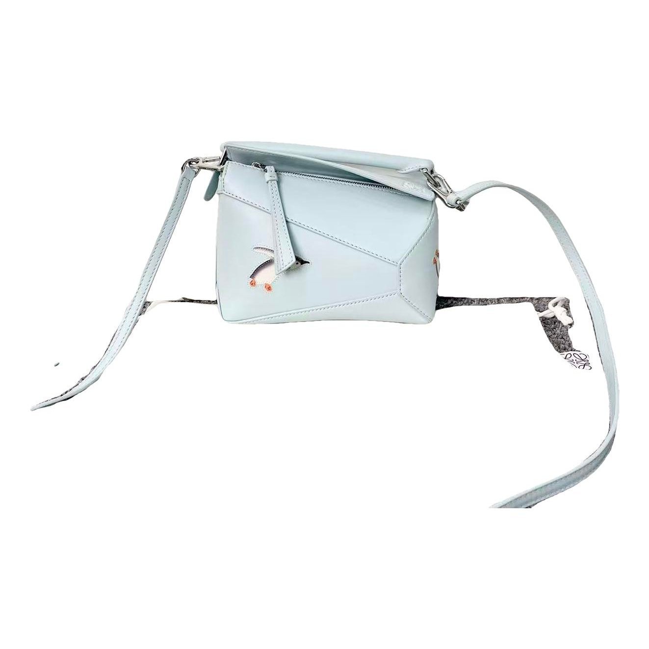Puzzle leather handbag