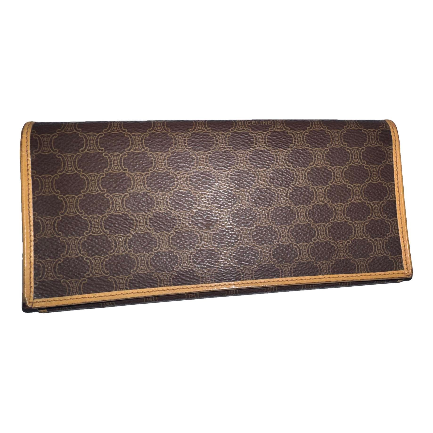 Triomphe Vintage leather clutch bag
