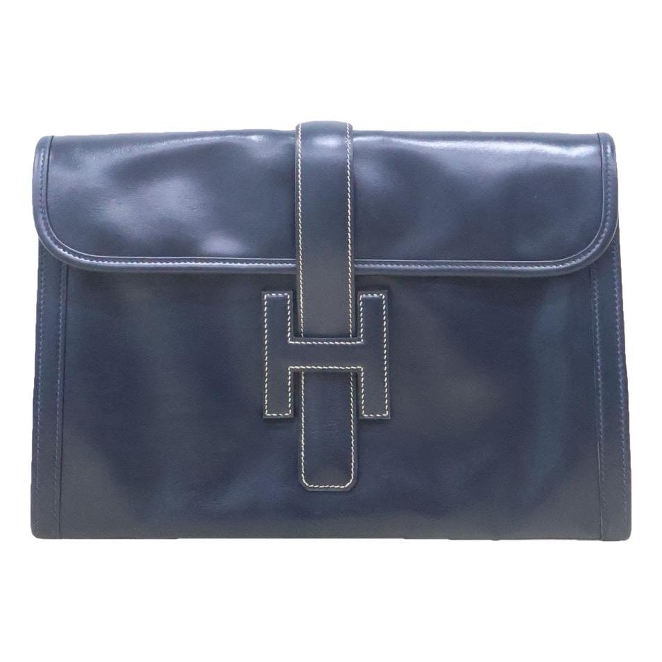 Jige leather clutch bag