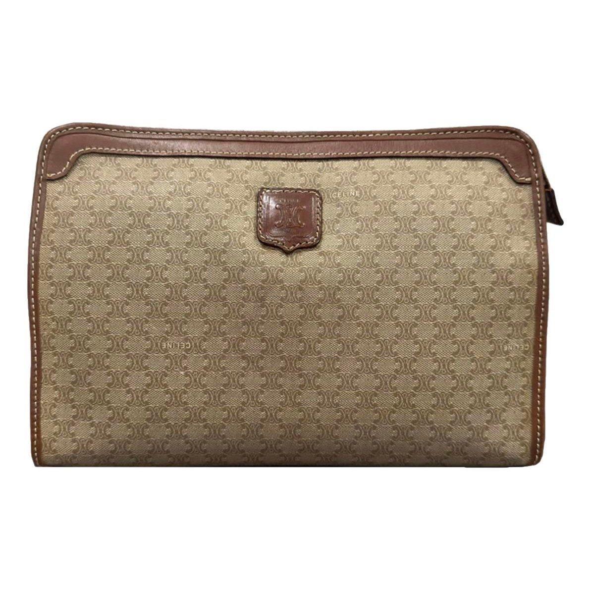 Triomphe Vintage leather clutch bag