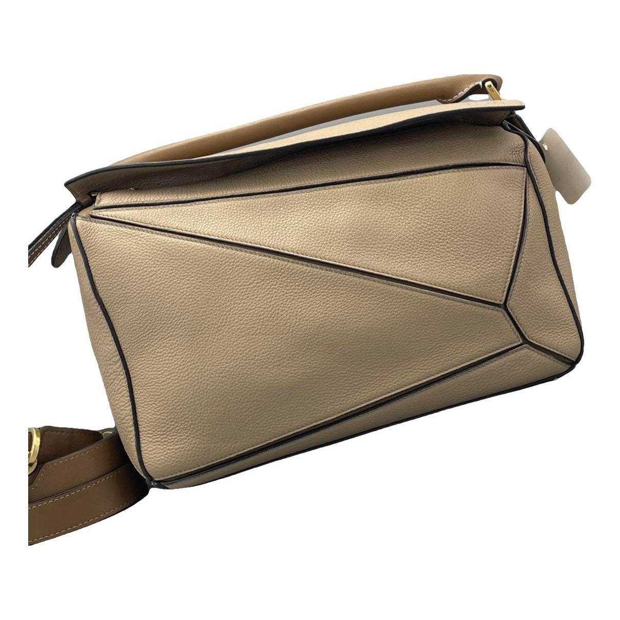 Puzzle leather handbag