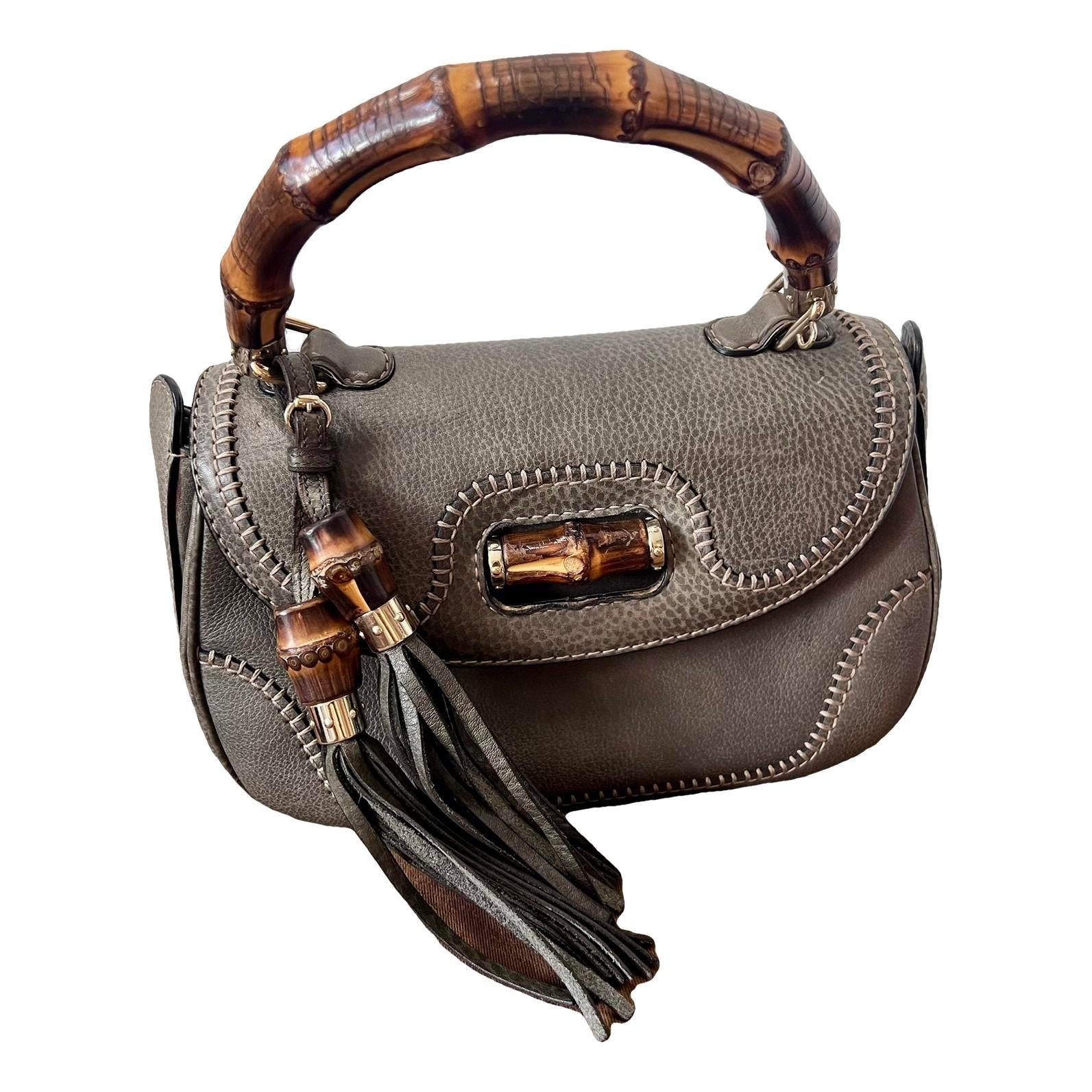 Convertible Pompon Bamboo Top Handle leather handbag
