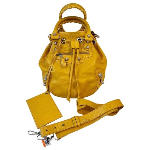 Pompon leather handbag