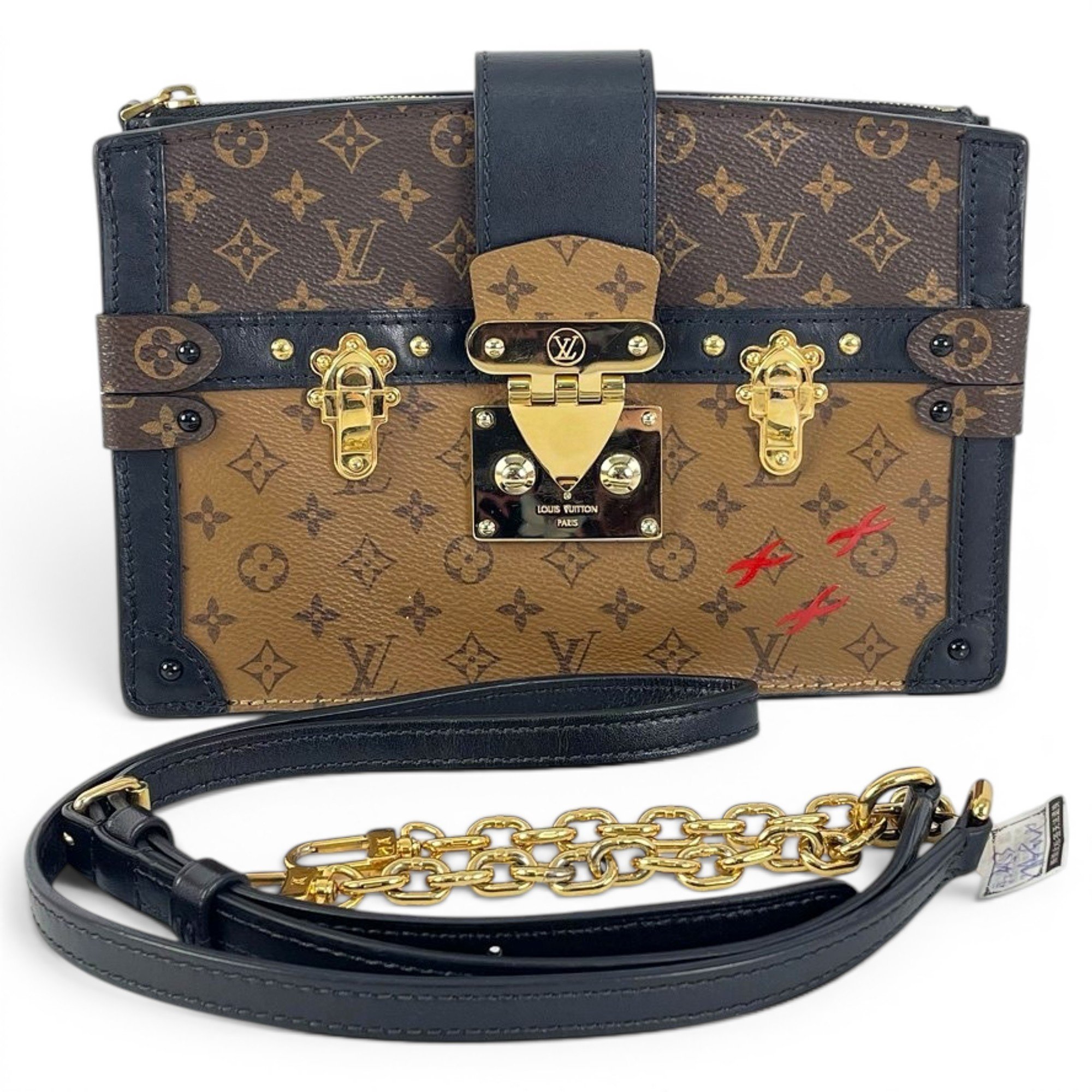 Pochette Trunk leather handbag