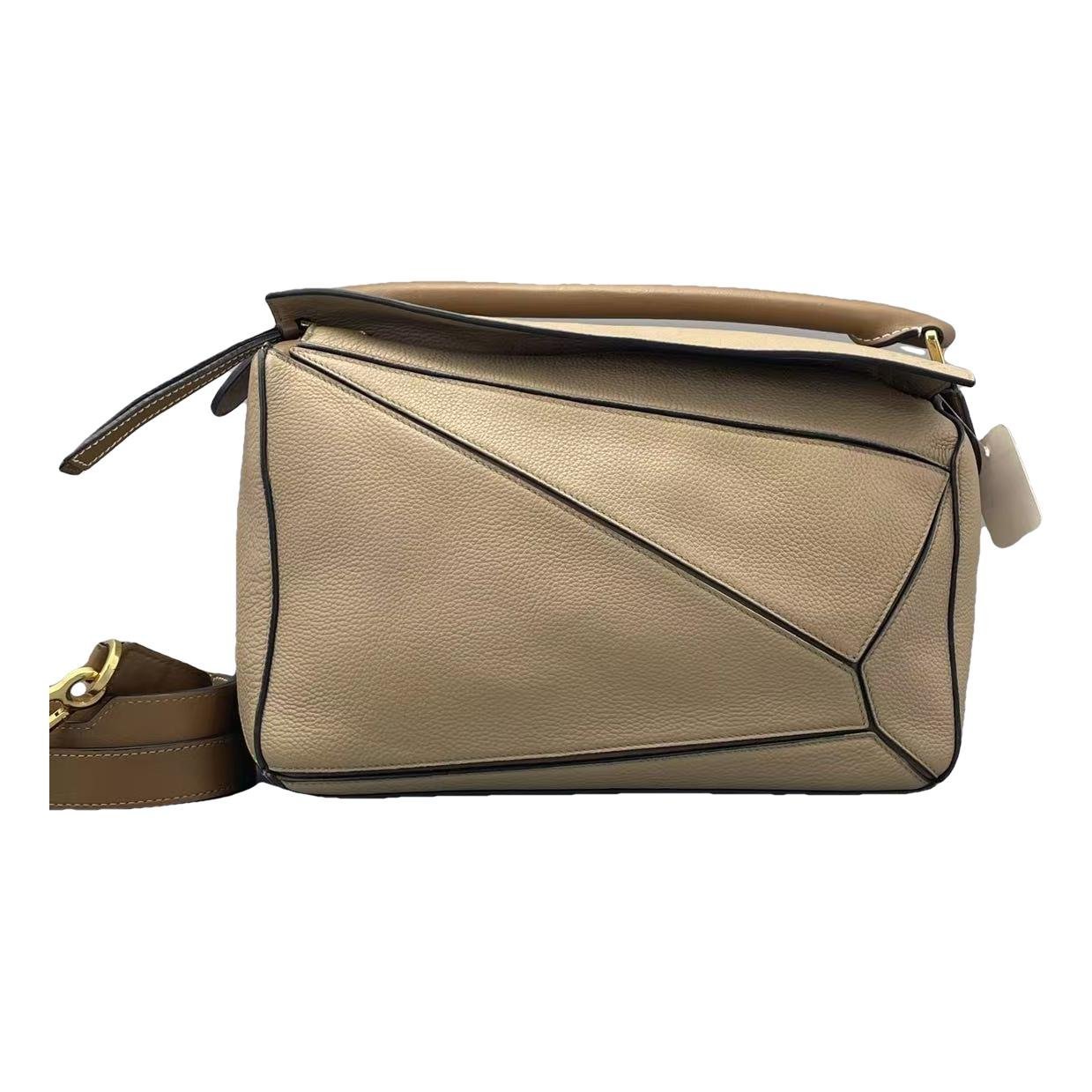 Puzzle leather handbag
