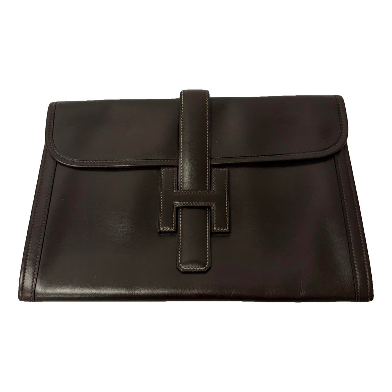 Jige leather clutch bag