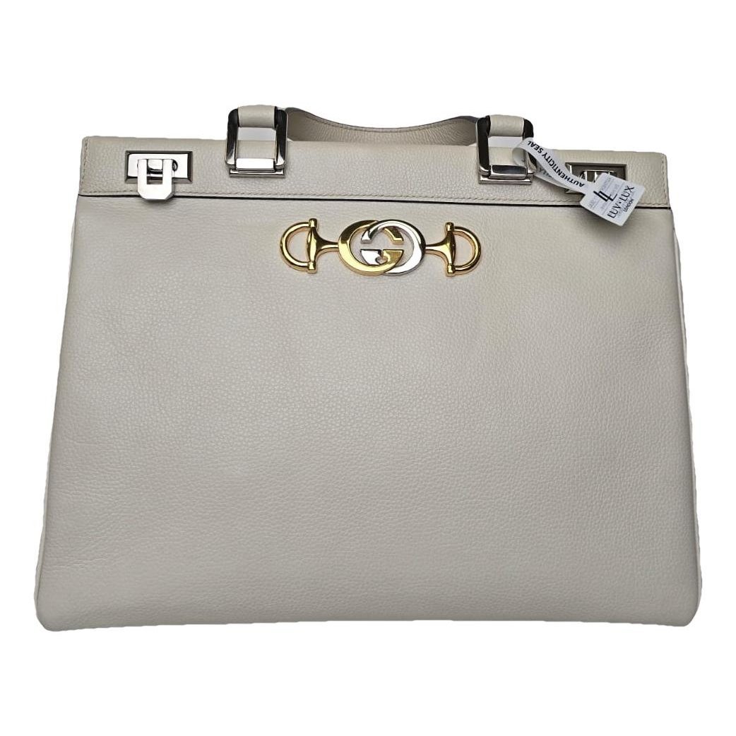 Ophidia Top Handle leather handbag