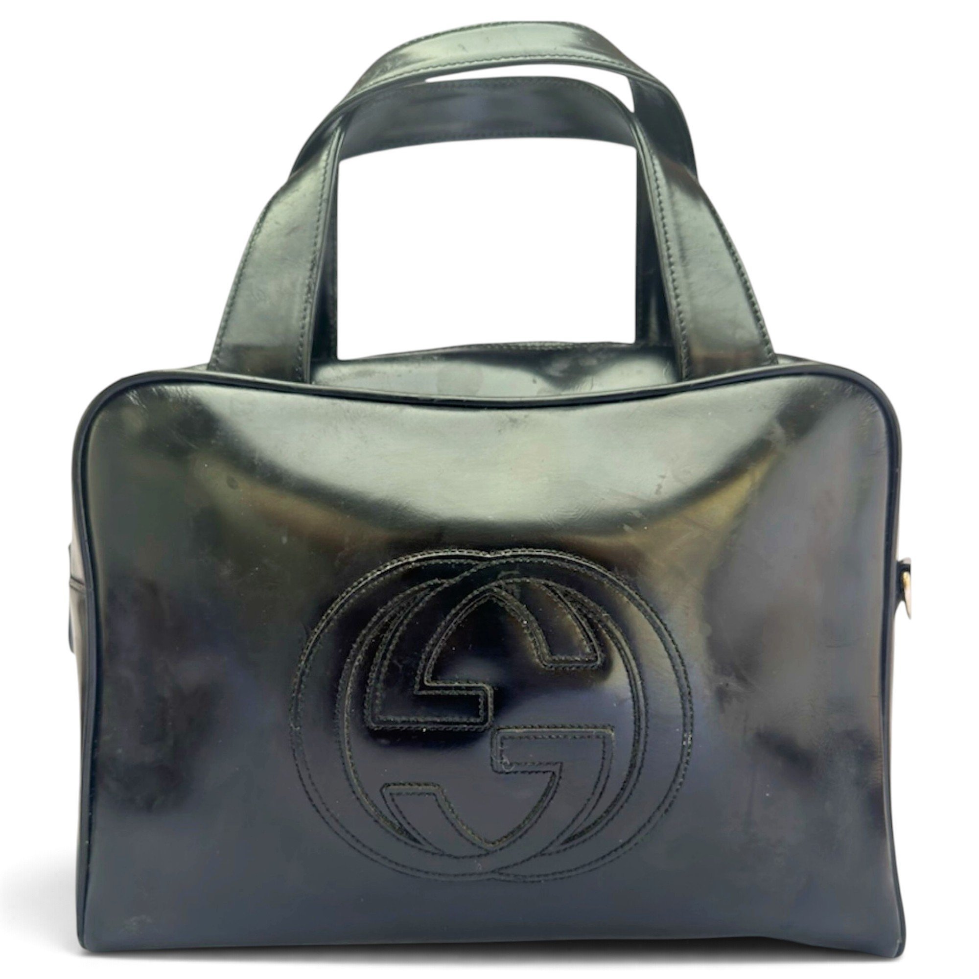 Interlocking patent leather handbag