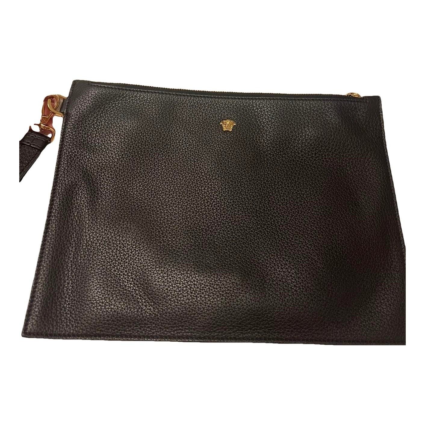 La Medusa leather clutch bag