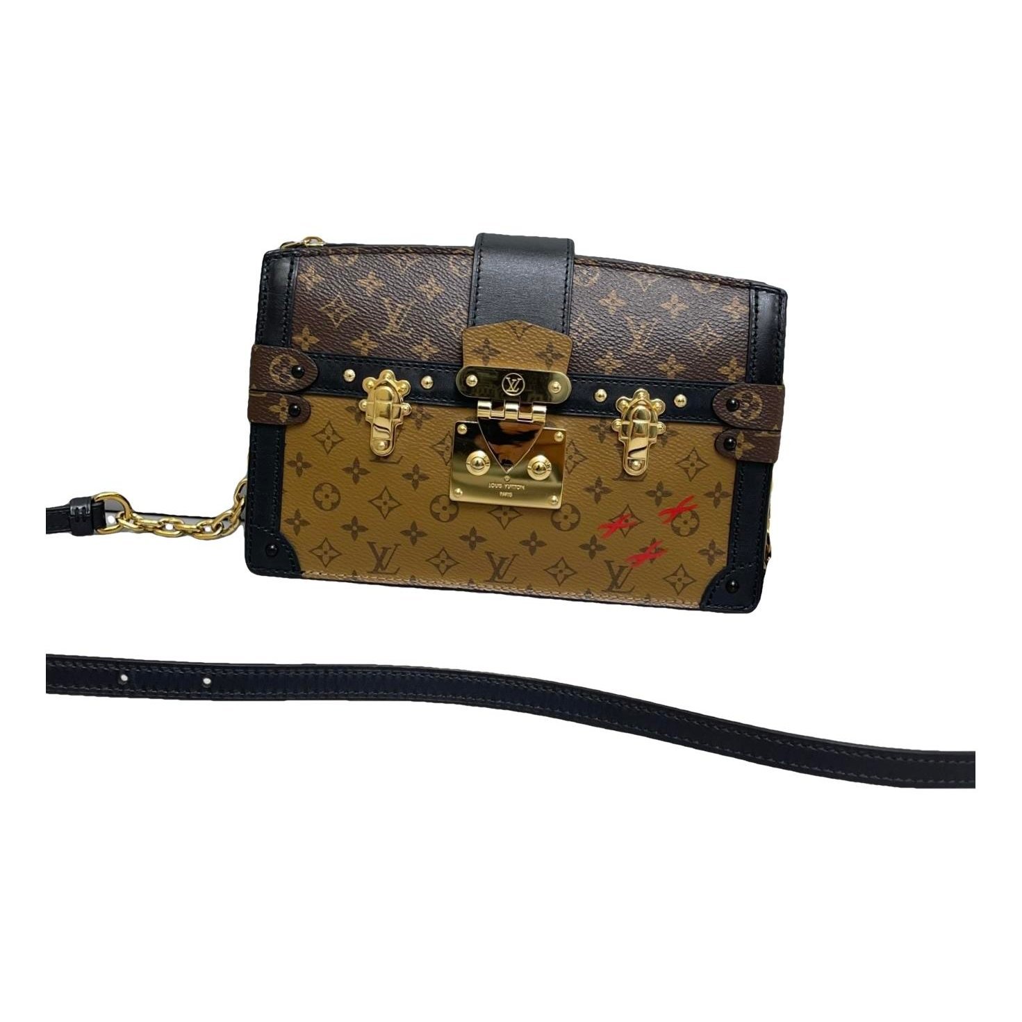 Pochette Trunk leather handbag