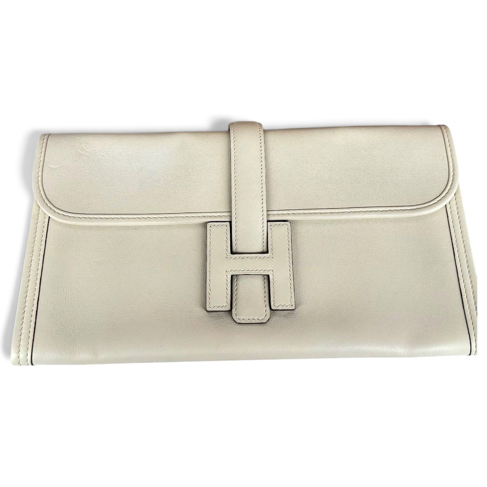 Jige leather clutch bag