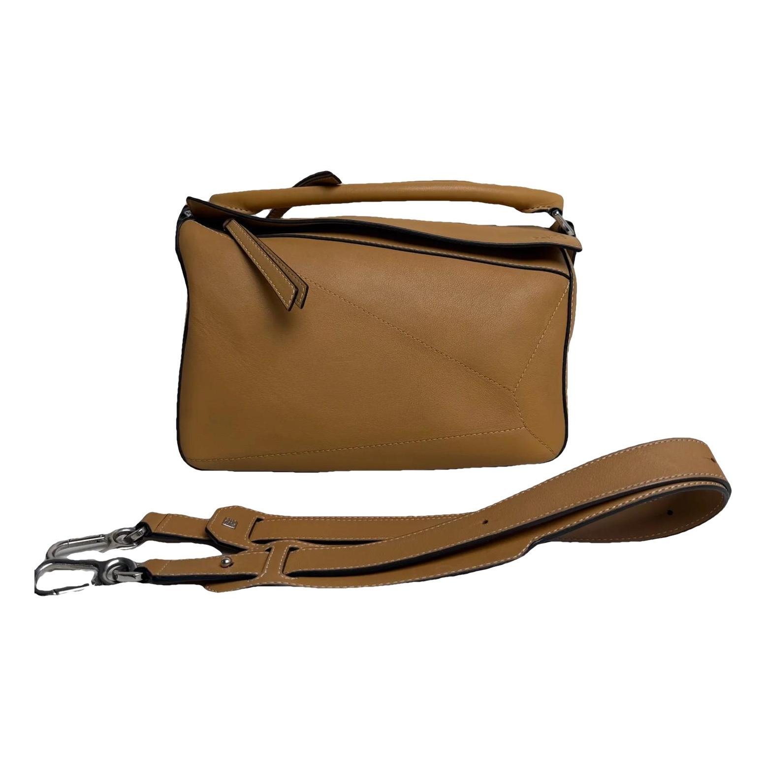 Puzzle leather handbag