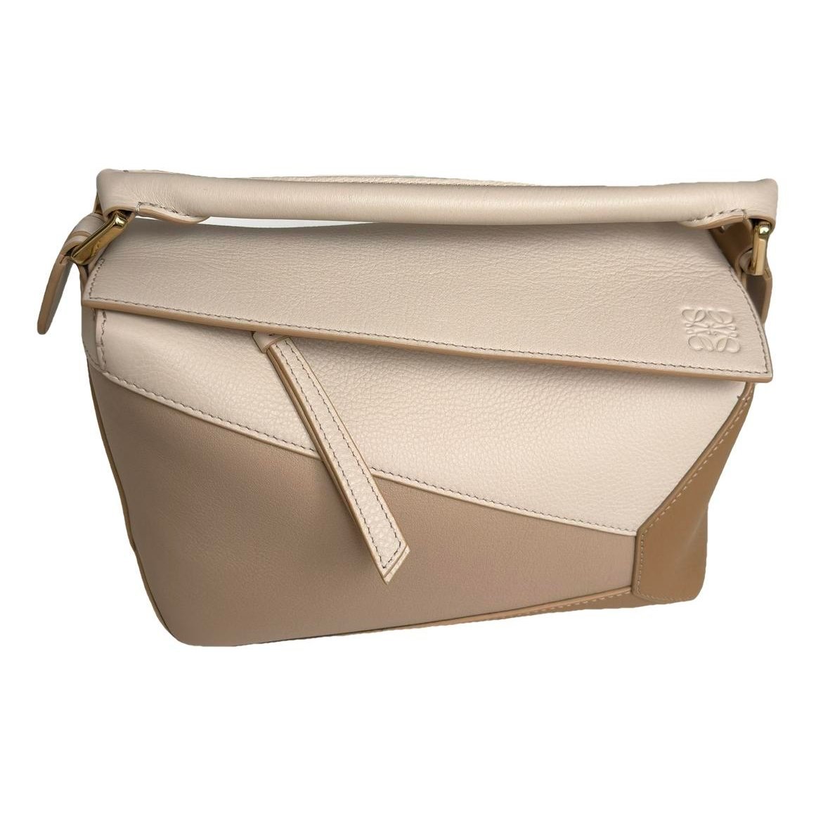 Puzzle leather handbag