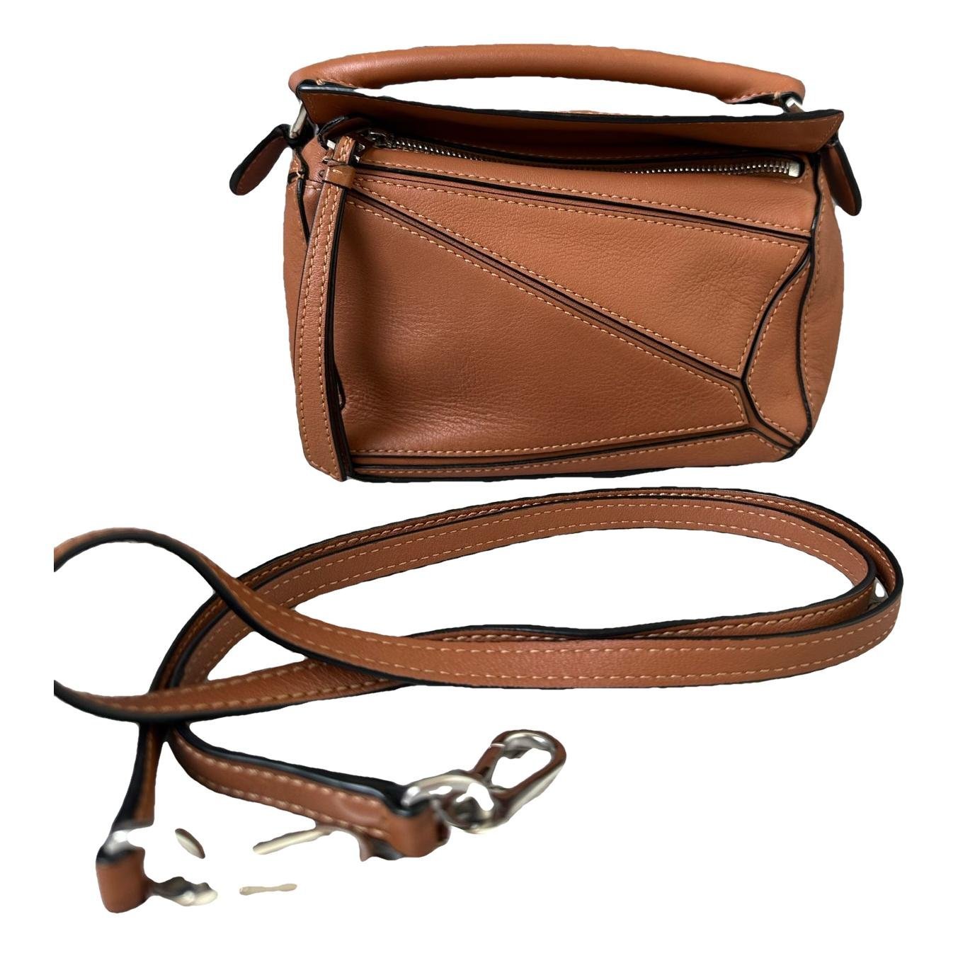Puzzle leather handbag