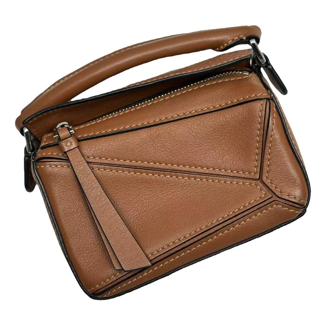 Puzzle leather handbag