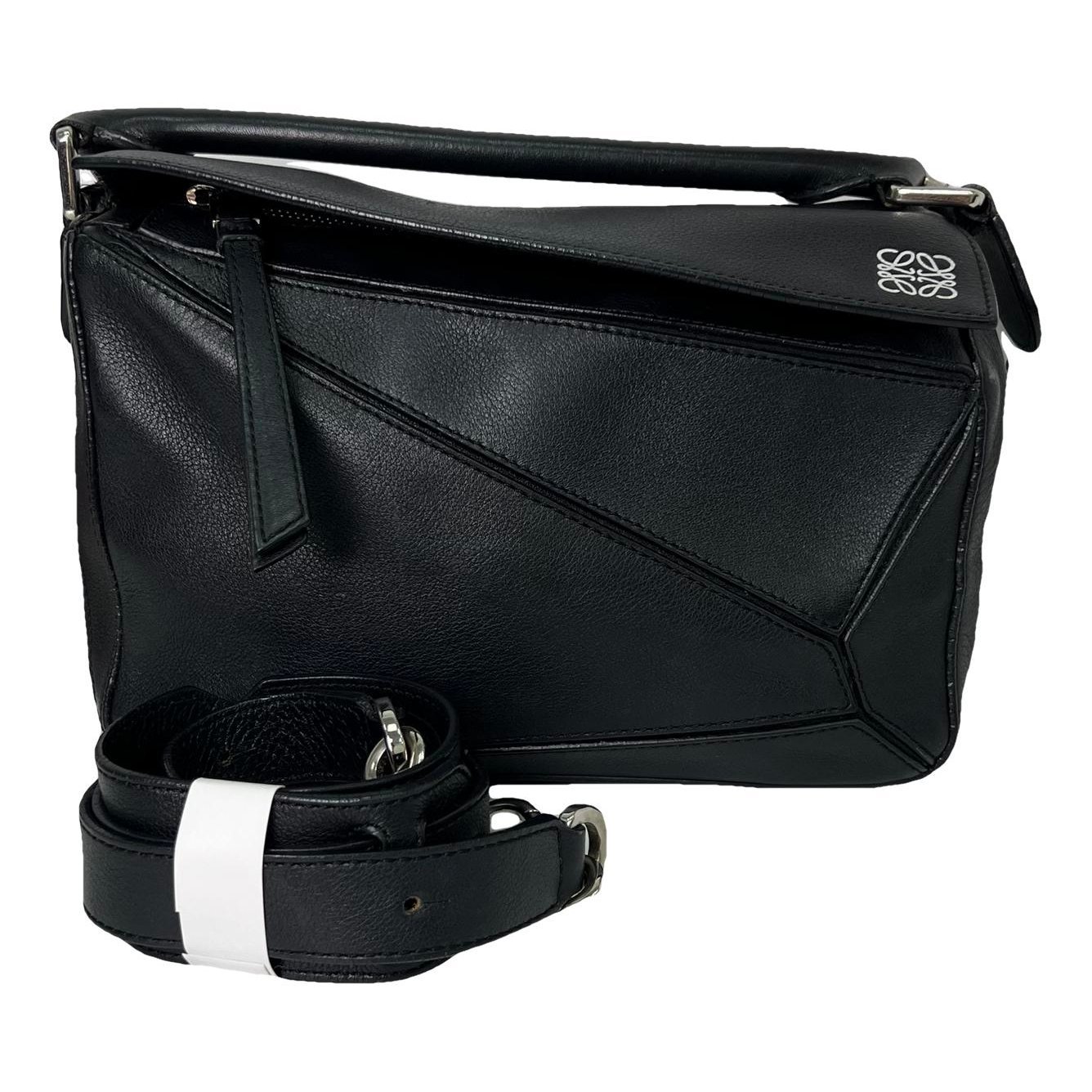 Puzzle leather handbag